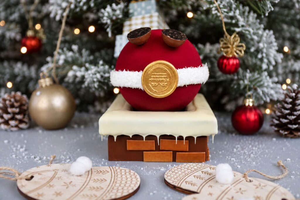 Chocolade kerstman zit vast in schouw